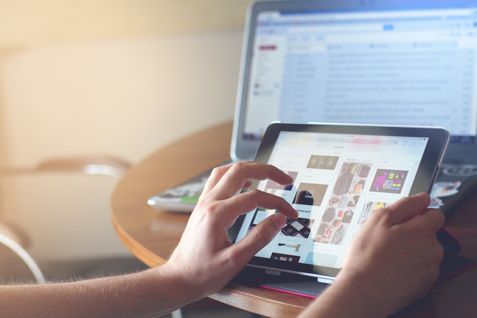 person holding black iPad simulating user behavior